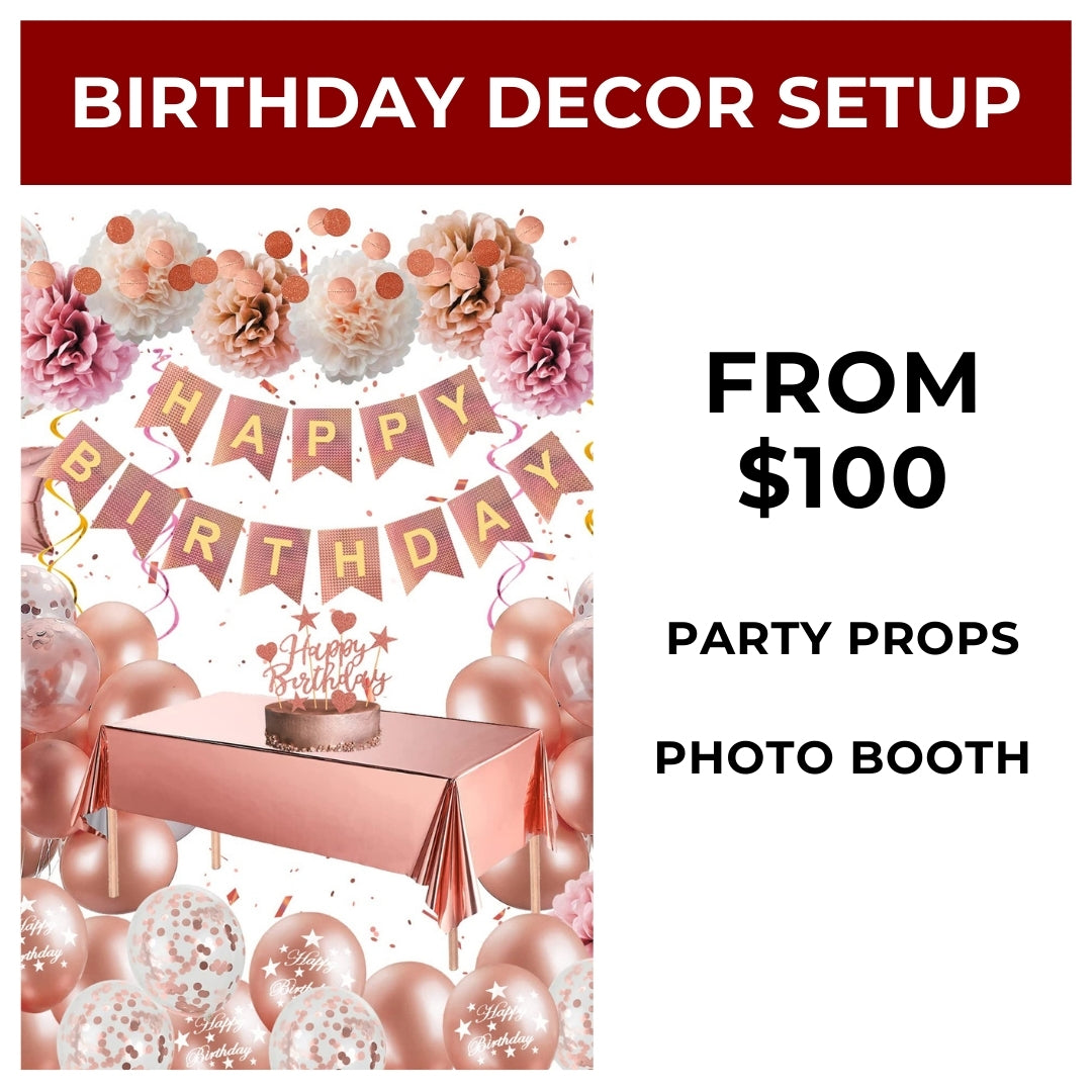 Birthday decor setup with balloons, tablecloth, and 'Happy Birthday' banner on a white background.